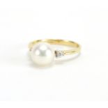 18ct gold Pearl ring with Diamond shoulders, M H maker mark, size M, approximate weight 2.7g The