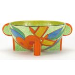 Clarice Cliff Bizarre Bobbins three footed bowl with twin handles, hand painted onto a green cafe-