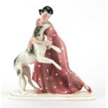 Art Deco figurine of a girl and her dog by Kattzhutte, factory marks to the base, 24.5cm high