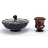 Moorcroft pottery Hibiscus powder bowl and cover, together with a Moorcroft pottery Flambe urn vase,