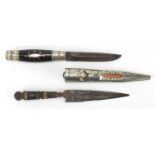 Two antique hunting knives, one with horn handle and sheath, one with engraved steel blade, the