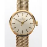 Ladies 9ct gold Omega wristwatch with 9ct gold strap, 2.1cm in diameter, approximate weight 24.4g