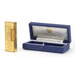 Dunhill gold plated pocket lighter, together with a Alfred Dunhill tooled leather box with silk