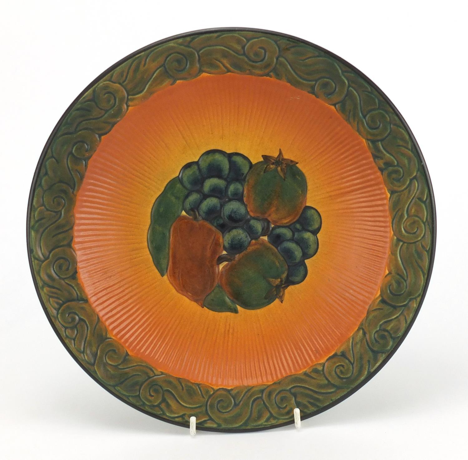 Danish pottery dish by Peter Ipsens Enke, hand painted and decorated in relief with fruit, impressed