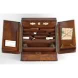 Victorian walnut stationery box, the sloped front opening to reveal a letter rack and day date