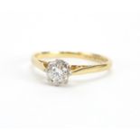 18ct gold Diamond solitaire ring, size R, approximate weight 2.6g The Diamond is modern round