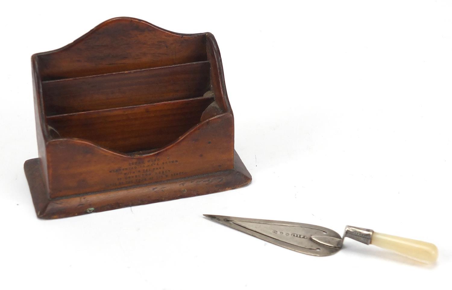 Miniature Mauchline Ware letter rack with Sir Walter Scott's Tomb design together with a silver