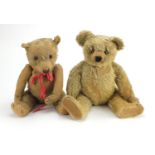 Two vintage golden teddy bear's, one straw filled, both with jointed limbs and beaded eyes, the