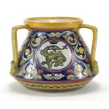 Italian pottery three handled vase, hand painted with a roundel of a mythical creature and foliate