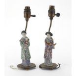 Pair of Chinese porcelain figural lamp bases with bronze mounts, each hand painted in the famille