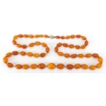 Butterscotch amber coloured bead necklace, 80cm in length, approximate weight 41.0g : For further