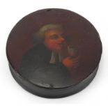 19th century circular Papier-mâché snuff box, the lid hand painted with a figure drinking, 8.5cm