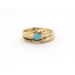 Antique unmarked gold serpent ring set with a cabochon turquoise, housed in a J.Simmons leather box,