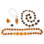 Group of amber coloured bead necklaces and loose beads, approximate weight 158.0g : For further