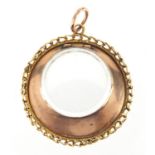 Circular unmarked gold mourning locket, 3cm in diameter, approximate weight 6.3g : For further