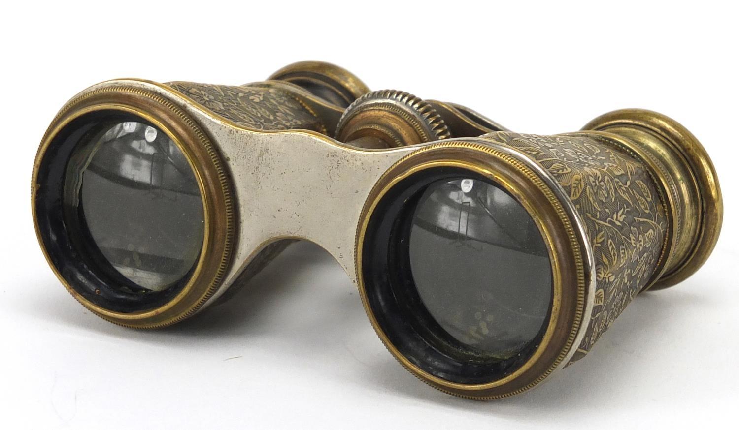 Pair of Edwardian brass opera glasses with octagonal barrels, engraved with flowers, 11cm wide : For