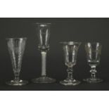 Four 19th century glasses, one with air twist stem and three with an etched design, the largest 16.