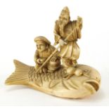 Japanese carved ivory Okimono of two fishermen upon a fish, character marks to the base, 11.5cm wide