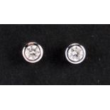 Pair of 18ct white gold diamond solitaire earrings : For further Condition Reports Please Visit