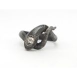 Antique unmarked silver serpent ring set with a diamond, housed in a leather box, size L,