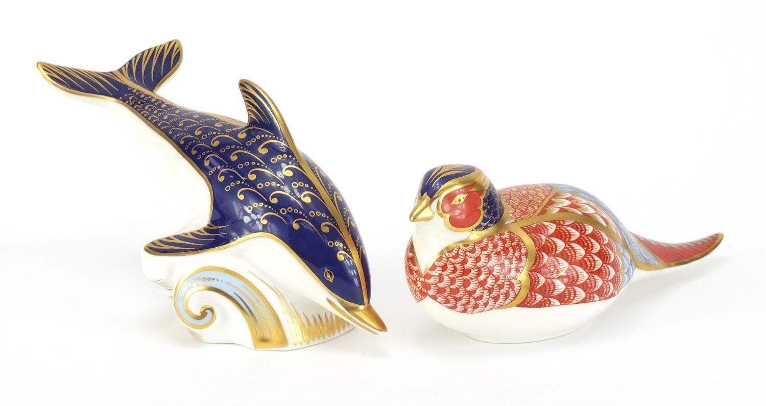 Two Royal Crown Derby paperweights with gold coloured stoppers, dolphin and pheasant, the largest