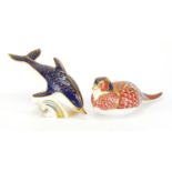Two Royal Crown Derby paperweights with gold coloured stoppers, dolphin and pheasant, the largest