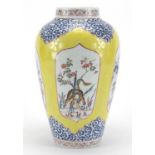 European porcelain vase hand painted with panels of animals and birds onto a yellow and foliate