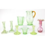 Uranium glassware and a pink Vaseline frilled glass vase, including two pairs of candlesticks and