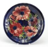 Moorcroft Poppy pattern pottery plate, impressed factory marks to the base, 22cm in diameter : For