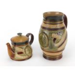 Doulton Lambeth teapot and jug commemorating William Ewart Gladstone, numbered 8468 and 8469, the