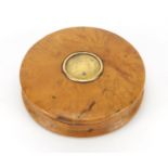 19th century circular burr yew snuff box, the lid inset with a Louis XVIII gold coloured coin, 6.5cm