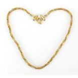 18ct three tone gold necklace set with sapphires to the clasp, 40cm in length, approximate weight