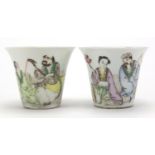 Pair of Chinese porcelain fluted tea cups, each hand painted in the famille rose palette with two