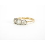 Unmarked gold diamond three stone ring, size O, approximate weight 2.4g : For further Condition