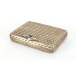 Rectangular 915 silver snuff box with hinged lid, engine turned decoration and set with a cabochon