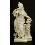 18th century bow porcelain figurine of a lady with flowers, Geoffrey Godden paper label to the