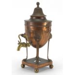 19th century copper and brass samovar, of urn form with ring turned handles and lion paw feet,