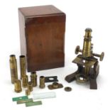 Victorian brass microscope by R Field & Son of Birmingham, with various lenses and slides, housed in