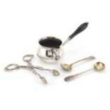 Silver items, brandy warmer and two spoons, together with a pair of silver coloured metal grape