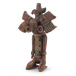 Peruvian hand painted terracotta flute in the form of a kneeling man, 24.5cm in length : For further