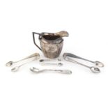 Silver items, milk jug, three pairs of sugar tongs and a Scottish spoon, various hallmarks,