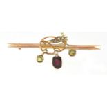 9ct gold bar brooch set with peridot, garnet and seed pearls, 4.5cm in length, approximate weight