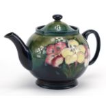 Moorcroft Freesia pattern pottery teapot, hand painted and impressed factory marks to the base, 15.