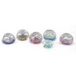 Six colourful glass paperweights including a Whitefriars Christmas 1979 Millefiori paperweight,