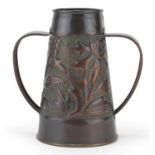 Irish Arts & Crafts copper vase with twin handles by John Williams, embossed with flowers, 19cm high