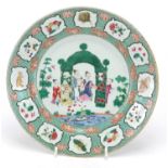 Chinese porcelain plate, finely hand painted in the famille verte palette with a family by a pond