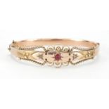 Victorian 9ct gold bangle set with a ruby and diamonds, Birmingham 1876, 6.5cm x 5.5cm,