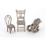Three silver dolls house chairs, various hallmarks, the largest 4.5cm high, approximate weight 30.0g
