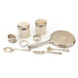 Silver items, hand mirror, two napkin rings, two spoons, fork, circular collar and two cut glass