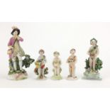 Three 18th century Bow porcelain figures of putti with baskets and flowers, together with a two